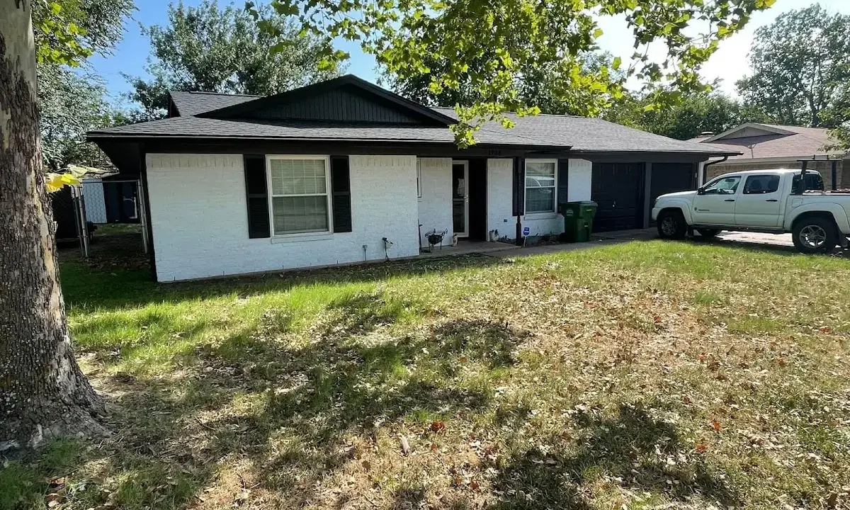 Professional roofing crew working on a residential roof in Pine